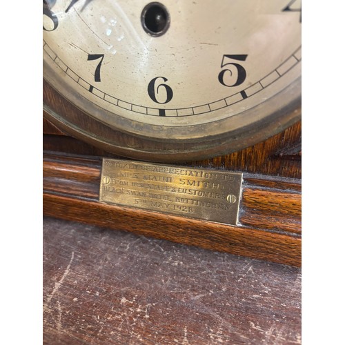 343A - An early 20th Century oak mantel clock