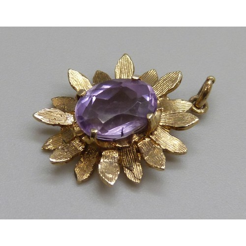 2148 - A 1970s 9ct gold amethyst set textured flower pendant, London 1974, 2g, 2.1cm including bale