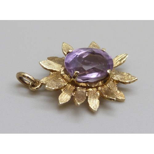 2148 - A 1970s 9ct gold amethyst set textured flower pendant, London 1974, 2g, 2.1cm including bale