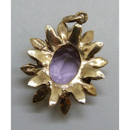 2148 - A 1970s 9ct gold amethyst set textured flower pendant, London 1974, 2g, 2.1cm including bale