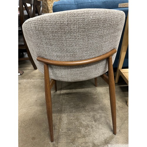 3084 - A beige upholstered curved back dining chair *This lot is subject to VAT