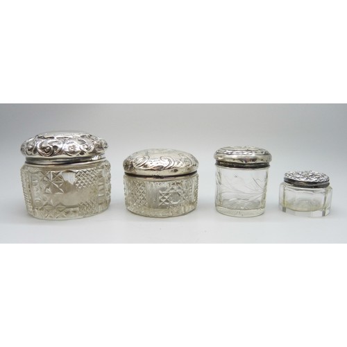 7245A - Four silver topped cut glass jars, Birmingham 1897, 1901, etc.