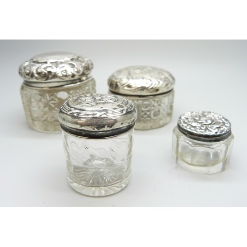 7245A - Four silver topped cut glass jars, Birmingham 1897, 1901, etc.