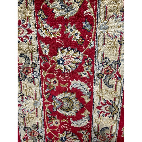 3222 - A rich red ground full pile cashmere carpet with all over floral pattern