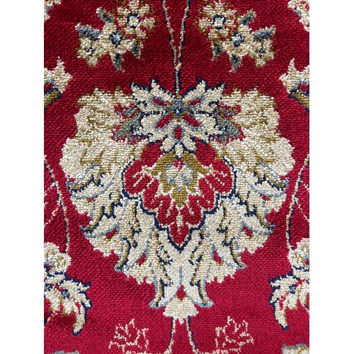 3222 - A rich red ground full pile cashmere carpet with all over floral pattern