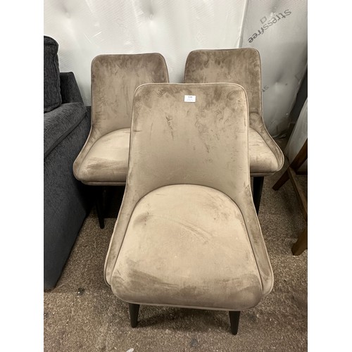 3166 - A set of three taupe velvet dining chairs *This lot is subject to VAT