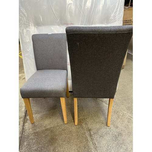 3283 - A pair of grey dining chairs with wooden legs *This lot is subject to VAT