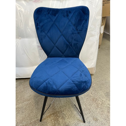 3284 - A pair of navy blue velvet dining chairs *This lot is subject to VAT