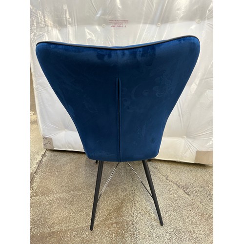 3284 - A pair of navy blue velvet dining chairs *This lot is subject to VAT