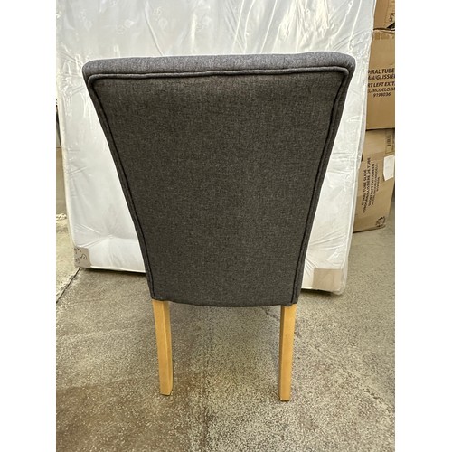 3285 - A pair of grey buttoned dining chairs with wooden legs *This lot is subject to VAT