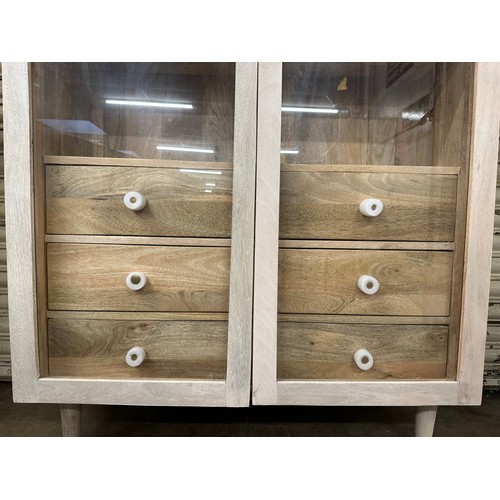 3199 - A whitewash Iconic 2 door glass cabinet *This lot is subject to VAT