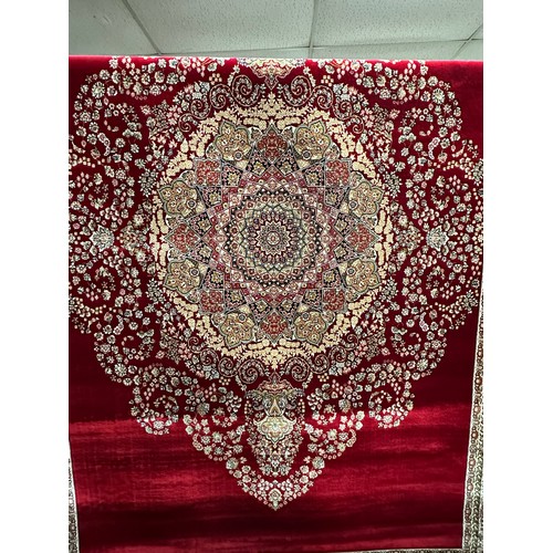 3025 - A fine woven full pile rich red ground unique floral pattern rug 230cm x 160cm