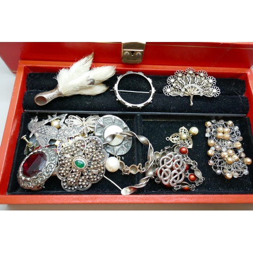 7214 - A collection of costume jewellery including three silver brooches