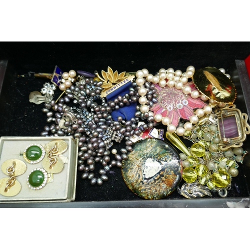 7214 - A collection of costume jewellery including three silver brooches