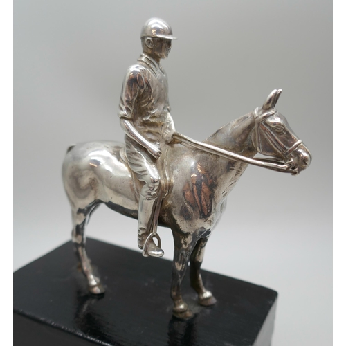 7315 - A Mappin & Webb Ltd. silver model of a horse and jockey, London 1913, model 9cm, 14cm including base... 