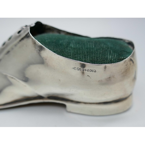 7322 - A silver pin cushion in the form of a shoe, Chester 1912, five inches, 81g total