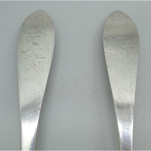 7325 - A pair of white metal serving spoons, with continental control marks, possibly German, 83g