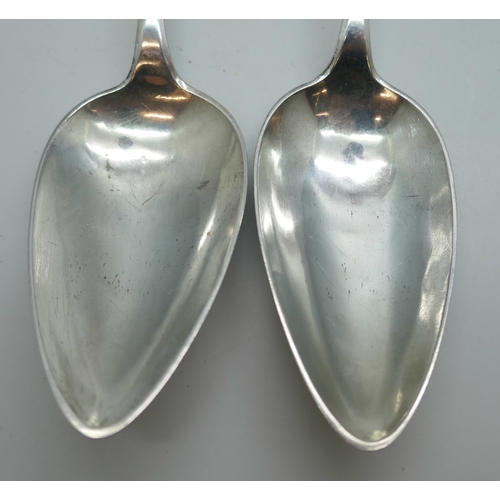 7325 - A pair of white metal serving spoons, with continental control marks, possibly German, 83g