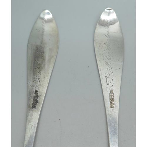 7325 - A pair of white metal serving spoons, with continental control marks, possibly German, 83g