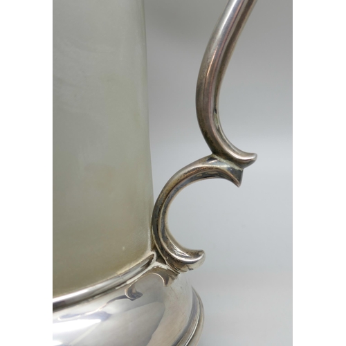 7328 - A Victorian silver and frosted glass jug, engraved with lion's head crest and motto 'Per Aspera Virt... 