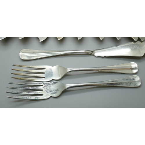 7330 - A set of twenty-four silver fish knives and forks, 12 + 12, Birmingham 1932, 1250g