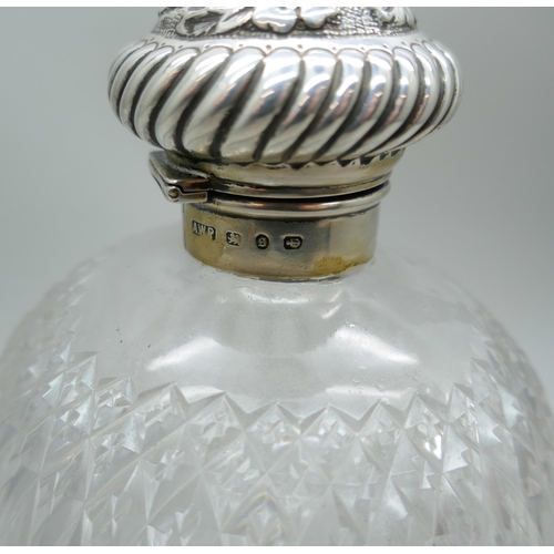 7335 - A large Victorian cut glass globular scent bottle with silver top, Birmingham 1892, top detached