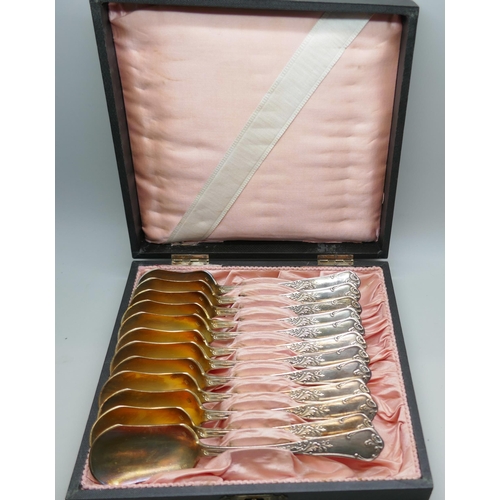 7341 - A cased set of white metal spoons with gilt bowls, continental control marks, 410g