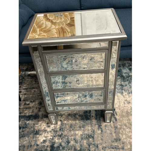 3121 - A silver mirrored chest of three drawers