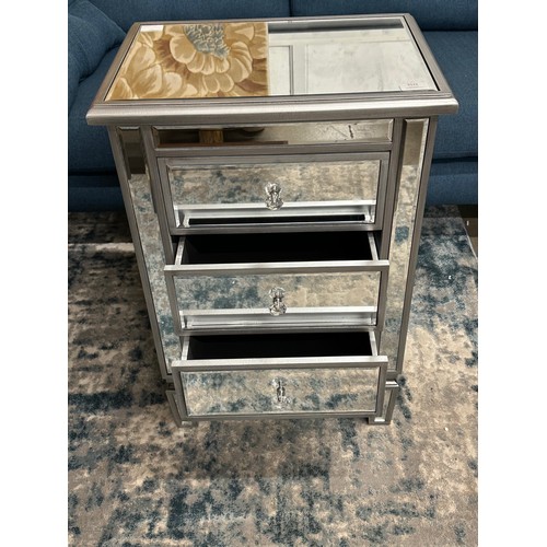 3121 - A silver mirrored chest of three drawers