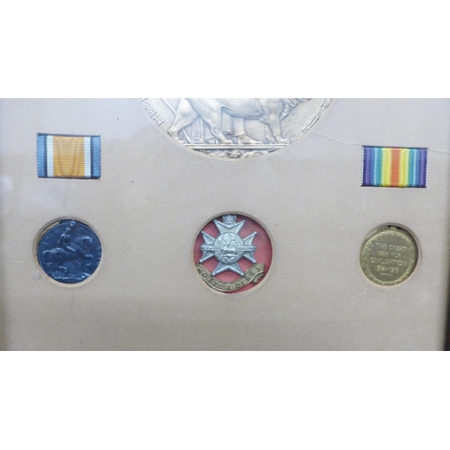 2001 - A World War I medal display, a Death plaque, War Medal, Victory medal and a scroll to Pte. Harry Mos... 