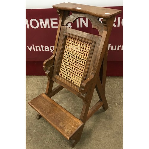 160 - A Victorian Gothic Revival oak and bergere metamorphic prayer chair