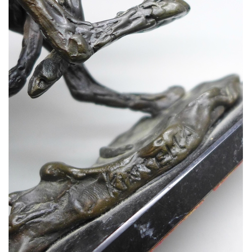 2038 - A bronze sculpture of a hare, signed Kinsella, height 12.5cm