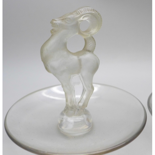 2043 - Two small Lalique glass dishes, swan and ram detail, signed to base