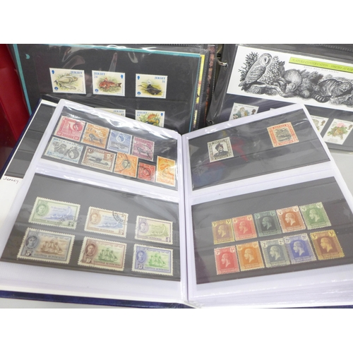 2060 - Stamps; a collection of stamps in three albums, including fifty mint stamps, twelve Millennium stamp... 