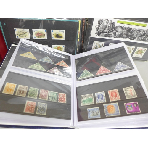 2060 - Stamps; a collection of stamps in three albums, including fifty mint stamps, twelve Millennium stamp... 