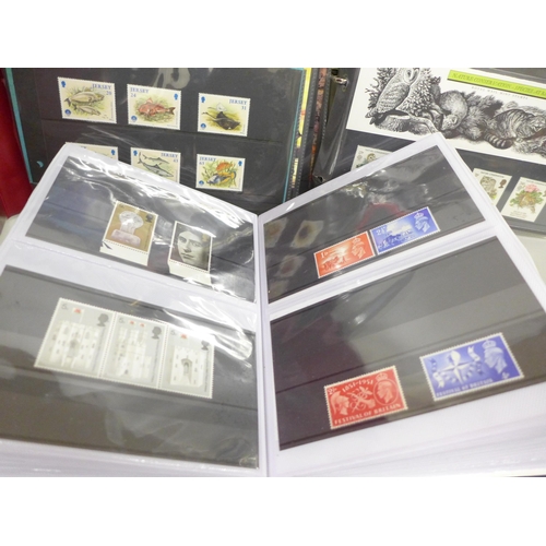 2060 - Stamps; a collection of stamps in three albums, including fifty mint stamps, twelve Millennium stamp... 