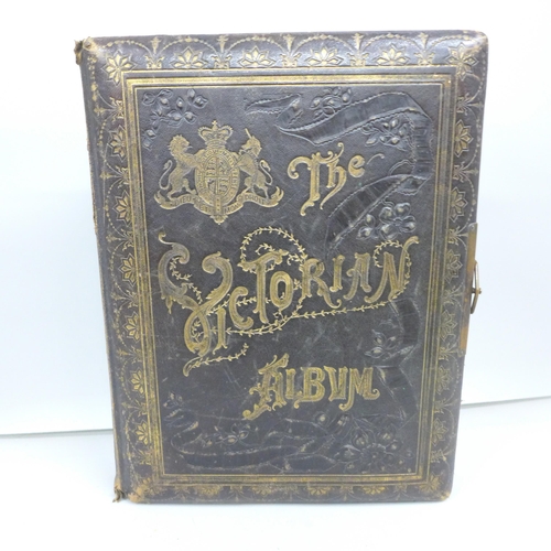 2062 - A Victorian photograph album with leather gilt binding and brass clasp with carte de visite photogra... 