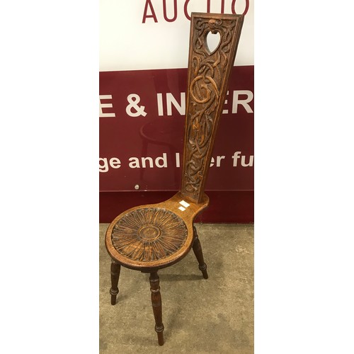 162 - An early 20th Century Welsh carved oak spinning chair