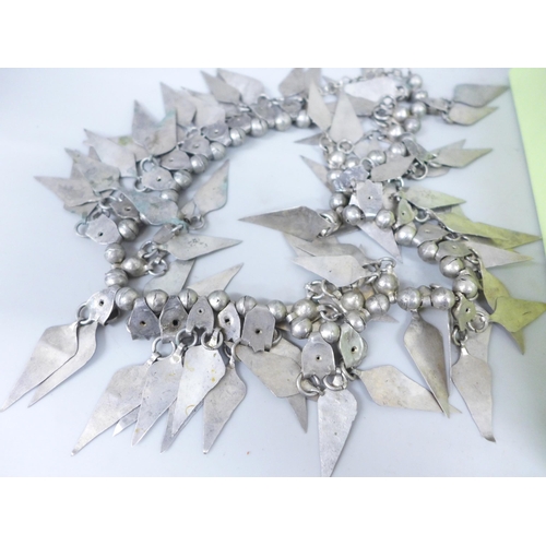 2094 - A collection of costume jewellery including Eastern silver-tone