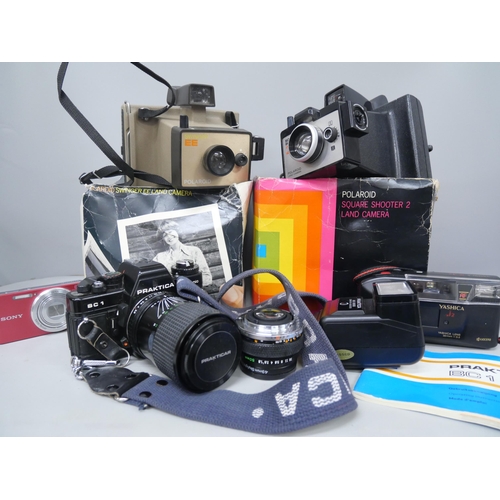 2130 - A Praktica BC1 camera, two Polaroid Land Cameras, etc.