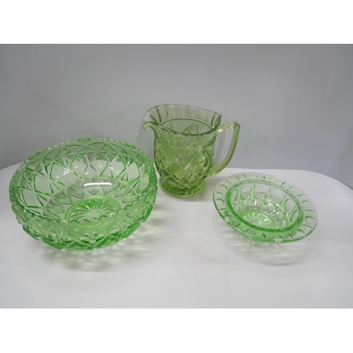 2184 - A collection of Art Deco style green glass comprising of jugs, bowls, vases, trinket boxes, and more... 