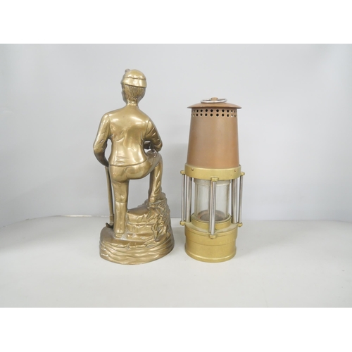 2196 - A brass miner figure and miner's lamp