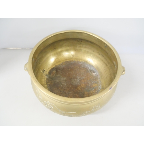 2197 - A Chinese bronze bowl with engraved dragon design to body.