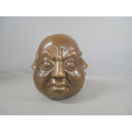 2201 - A bronze four sided Buddha head together with another sculptural figure