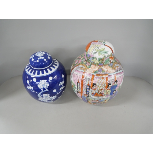 2202 - Two oriental lidded ginger jars one with blue and white prunus pattern, the other with depictions of... 