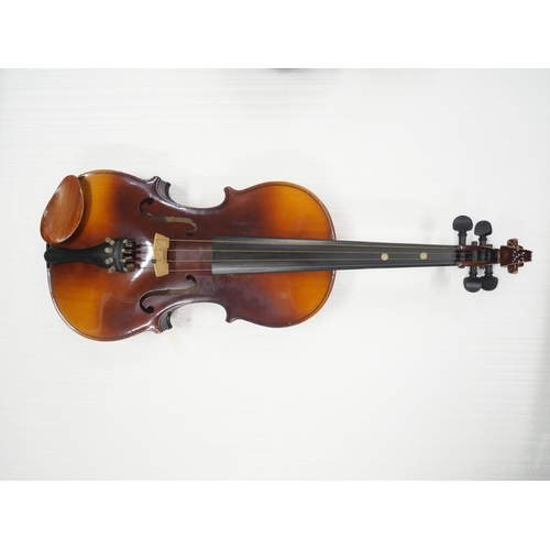 2219 - A cased Czech violin, length of back 35.5cm, two bows, cased, main body cracked