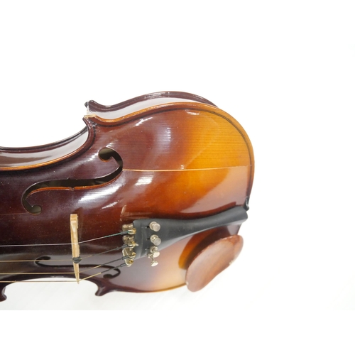 2219 - A cased Czech violin, length of back 35.5cm, two bows, cased, main body cracked