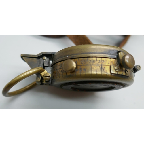 2227 - An early 20th century brass compass, stamped G. Allison, with leather case