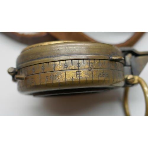 2227 - An early 20th century brass compass, stamped G. Allison, with leather case