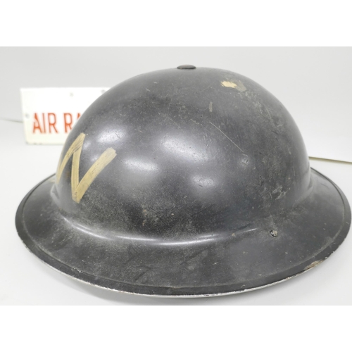 2246 - A British World War II Wardens helmet and an enamelled ARP Air Raid Warden plaque, plaque 77mm x 229... 